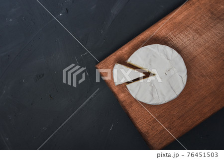 cheese camembert with mold on cutting board cheese camembert with mold on cutting board 76451503