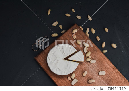 cheese camembert with mold and nuts and wedding rings cheese camembert with mold and nuts and wedding rings 76451549