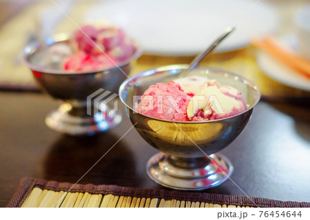 Fruit ice cream in metal bowls 76454644