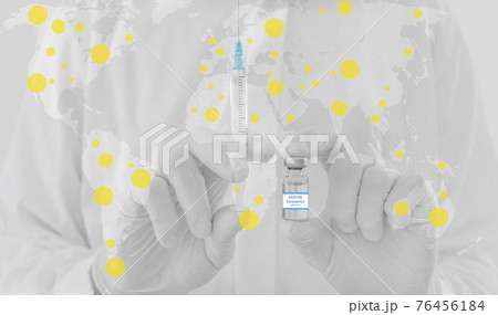 World map and doctor hands holding a vaccine bottle and syringe, beginning of worldwide mass vaccination for coronavirus COVID-19, world immunization concept. Selective focus World map and doctor hands holding a vaccine bottle and syringe, beginning of worldwide mass vaccination for coronavirus COVID-19, world immunization concept. Selective focus 76456184