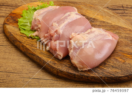 Raw chicken boneless and skinless leg 76459397