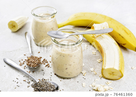 Milkshake with chia and banana in jars on granite table 76461360