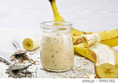 Milkshake with chia and banana in jar on table 76461362