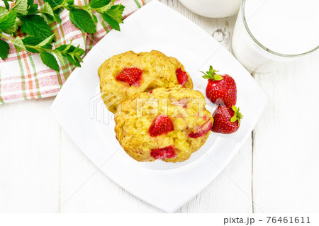 Scones with strawberry in plate on board top 76461611