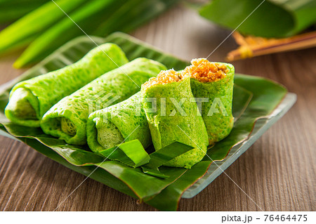 Malaysia popular sweet dessert with coconut known as kuih ketayap Malaysia popular sweet dessert with coconut known as kuih ketayap 76464475
