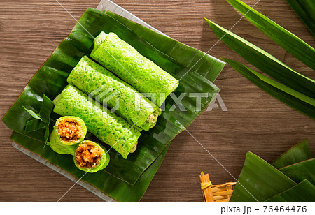 Malaysia popular sweet dessert with coconut known as kuih ketayap Malaysia popular sweet dessert with coconut known as kuih ketayap 76464476