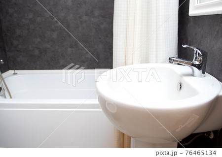 Bathroom sink and faucet in modern bathroom interior. Washbasin and bath 76465134