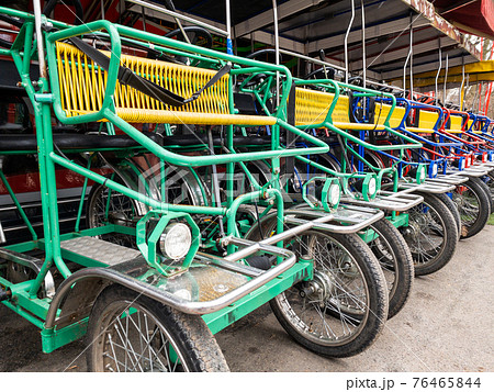 Italian bicycle rickshaws for walking in the park 76465844
