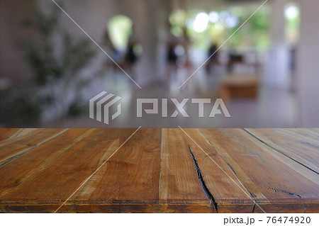 Empty wooden table in front of abstract blurred Cafe, restaurant at night. For montage product display or design key visual layout - Image Empty wooden table in front of abstract blurred Cafe, restaurant at night. For montage product display or design key visual layout - Image 76474920