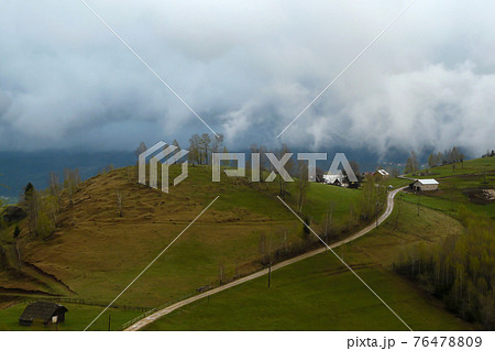 Clouds over the Carpathian Mountains, near Magura Village, Transylvania, Romania. 76478809