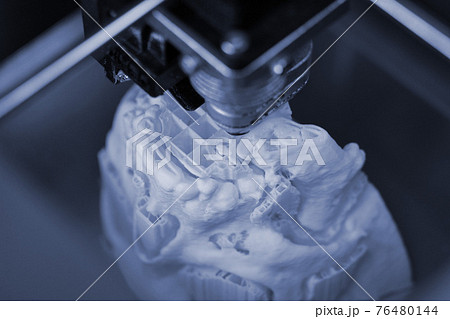 3D printer prints the form of molten plastic white. 76480144