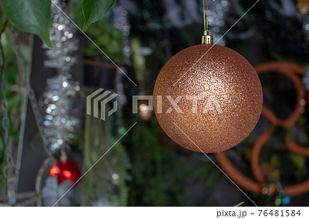 Single christmas ball decoration on a crib Single christmas ball decoration on a crib 76481584