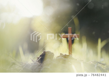 Cross on blurry sunset background. Cross on blurry sunset background. 76482441