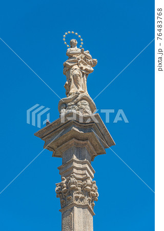 Statues at Marian Column or Holy Trinity at Hradcanske Square for bubonic plague pandemics in Prague, Czech Republic, details, closeup 76483768