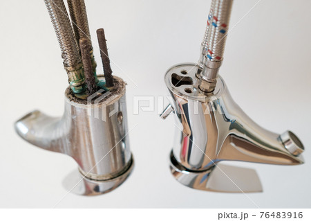 A new and an old faucet or water tap with deposited minerals on the crane aerator. A new and an old faucet or water tap with deposited minerals on the crane aerator. 76483916