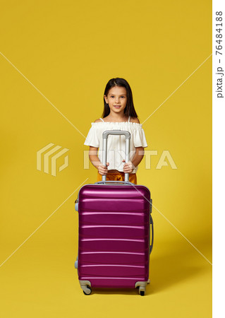 Happy little child girl in hat with pink suitcase Happy little child girl in hat with pink suitcase 76484188