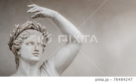 Statue of sensual Roman renaissance era woman in circlet of bay leaves, Potsdam, Germany, details, closeup 76484247