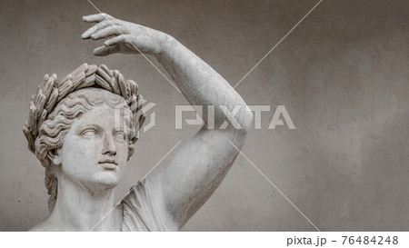 Statue of sensual Roman renaissance era woman in circlet of bay leaves, Potsdam, Germany, details, closeup 76484248
