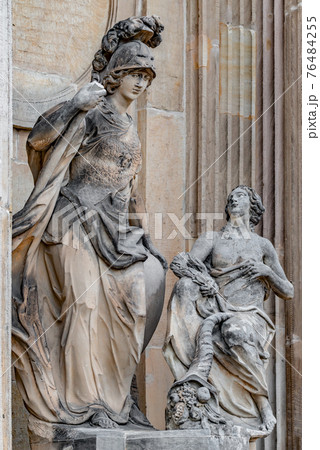 Statue of beautiful naked woman with horn of plenty and Roman soldier in Potsdam University, Germany 76484255