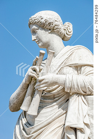 Ancient statue of a sensual renaissance era woman with musical instruments as pipes, in Potsdam, Germany Ancient statue of a sensual renaissance era woman with musical instruments as pipes, in Potsdam, Germany 76484299