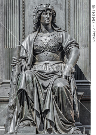 Old statue of a sensual woman warrior as defender with lion head and club at the Neumarkt in downtown of Dresden, Germany, details, closeup 76484549