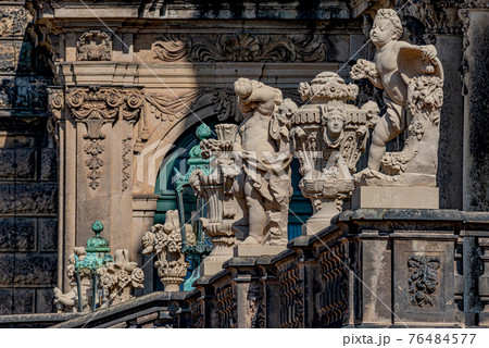 Row of old mythological and religious statues in the Zwinger palace and garden in downtown of Dresden, Germany 76484577