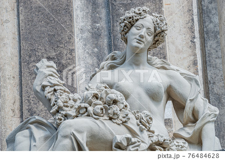 Old statue of a sensual Baroque Era naked woman in downtown of Dresden, Germany, details, closeup 76484628