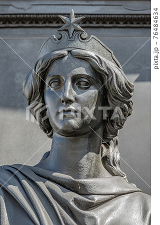 Old statue of a sensual beautiful woman warrior as defender at the Neumarkt in downtown of Dresden, Germany, details, closeup Old statue of a sensual beautiful woman warrior as defender at the Neumarkt in downtown of Dresden, Germany, details, closeup 76484634