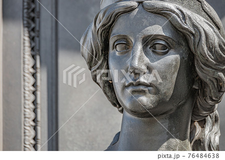 Old statue of a sensual beautiful woman warrior as defender at the Neumarkt in downtown of Dresden, Germany, details, closeup Old statue of a sensual beautiful woman warrior as defender at the Neumarkt in downtown of Dresden, Germany, details, closeup 76484638