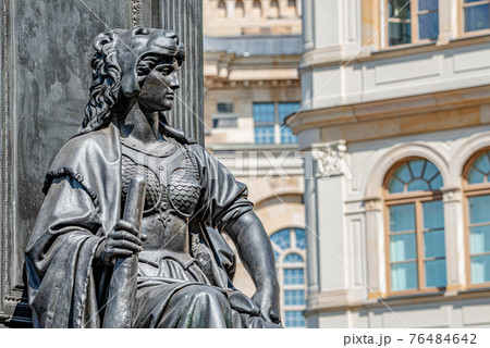 Old statue of a sensual woman warrior, Amazonian, as defender with lion head and club at the Neumarkt in downtown of Dresden, Germany, details, closeup 76484642