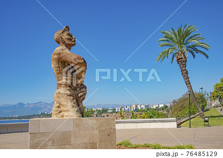 Karaalioglu City Park with statues, observation balconies and palms in Antalya, Turkey, at blue sky and sunny day. 76485129