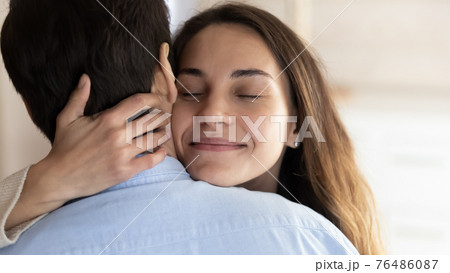 Close up of happy woman hug husband Close up of happy woman hug husband 76486087
