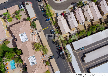 Aerial view of mixing single family homes, apartment buildings a residential district a Avondale near Phoenix Arizona US 76486552