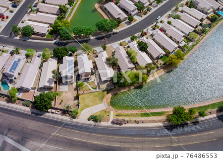 Near Phoenix Arizona Avondale city the aerial view of residential houses neighborhood and apartment complex aerial drone view on USA 76486553