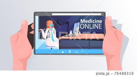 doctor in mask giving online speech on tablet screen coronavirus pandemic fight against covid-19 concept 76488319