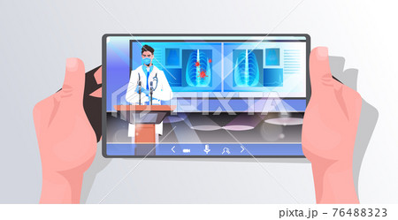 male doctor in mask giving speech at tribune with microphone on tablet screen fight against coronavirus male doctor in mask giving speech at tribune with microphone on tablet screen fight against coronavirus 76488323