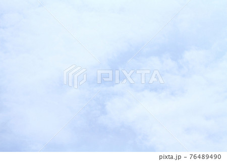 Beautiful blue sky and white clouds of various shapes with sunlight Nature background 76489490