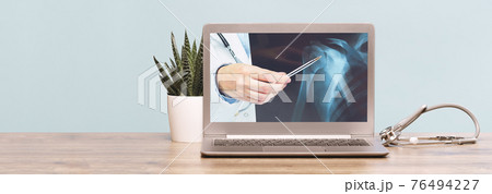 Stethoscope on a laptop. Virus season, pandemic. Smart working Stethoscope on a laptop. Virus season, pandemic. Smart working 76494227
