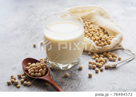 Soy milk and soy on the table 76494572