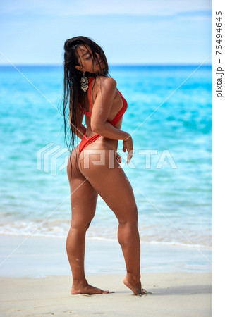 Sexy girl enjoying on the sand at tropical beach Sexy girl enjoying on the sand at tropical beach 76494646