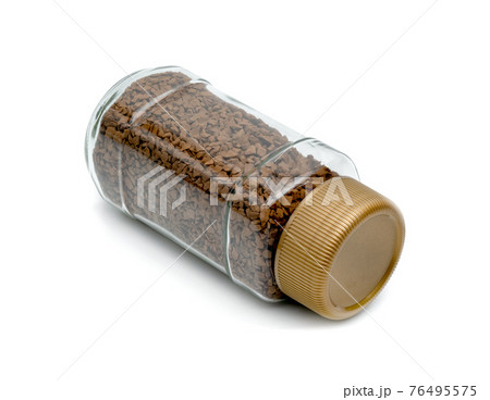 Instant coffee powder in glass bottle isolated on white background 76495575