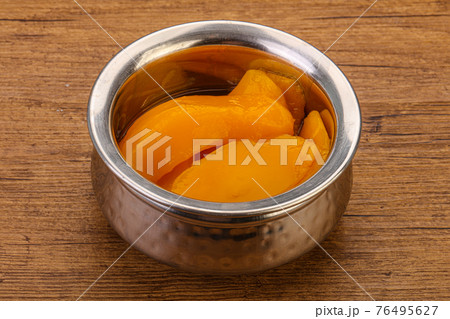 Sweet mango slices in syrop Sweet mango slices in syrop 76495627