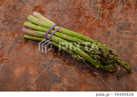 Vegan cuisine - Raw asparagus heap Vegan cuisine - Raw asparagus heap 76495628