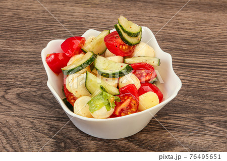 Salad with vegetables and mozzarlla Salad with vegetables and mozzarlla 76495651