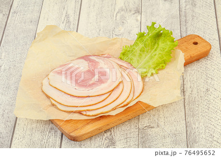 Sliced Pancetta sausage over board 76495652