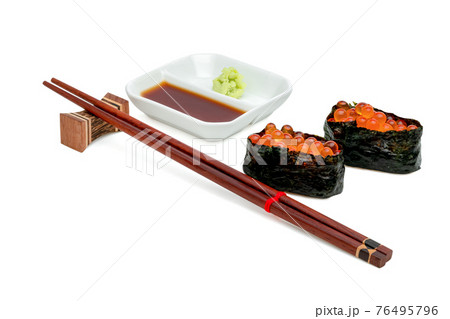 rolled sushi of salmon roe nigiri with japanese wasabi sauce and wooden chopsticks isolated on white background ,include clipping path rolled sushi of salmon roe nigiri with japanese wasabi sauce and wooden chopsticks isolated on white background ,include clipping path 76495796