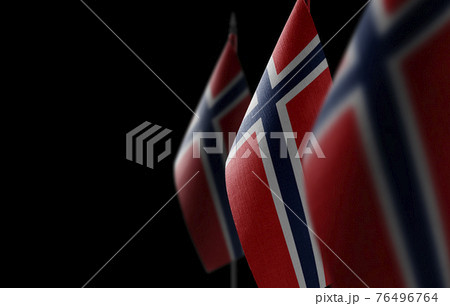 Small national flags of the Norway on a black background 76496764