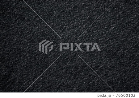 jeans fabric denim texture background. closeup. high quality denim. rough cotton jeans fabric. old denim material. denim fabric for casual  clothes, natural material for working clothes 76500102
