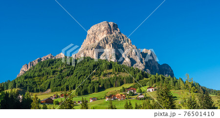 Panoramic view of magical Dolomite peak Sassongher, forests, valleys at Autumn, South Tyrol, Italy Panoramic view of magical Dolomite peak Sassongher, forests, valleys at Autumn, South Tyrol, Italy 76501410