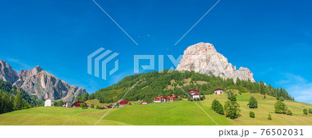 Panoramic view of magical Dolomite peak Sassongher, forests, valleys at sunny day and blue sky, Colfosco, Corvara, South Tyrol, Italy, wide angle Panoramic view of magical Dolomite peak Sassongher, forests, valleys at sunny day and blue sky, Colfosco, Corvara, South Tyrol, Italy, wide angle 76502031
